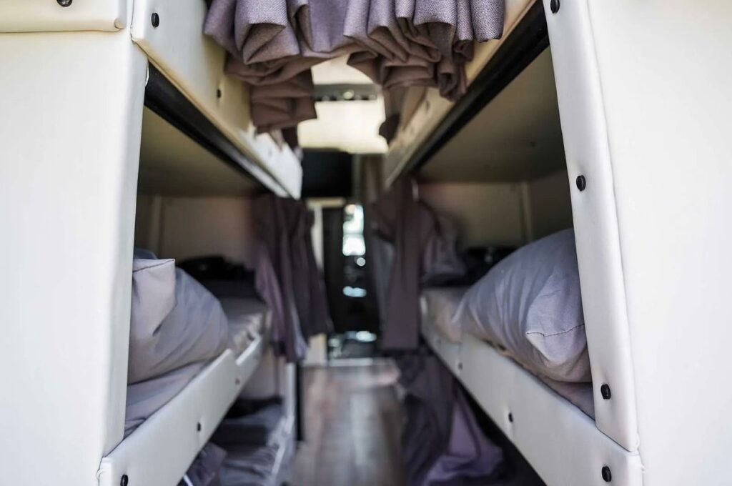 Interior bunk beds inside a custom rental van.