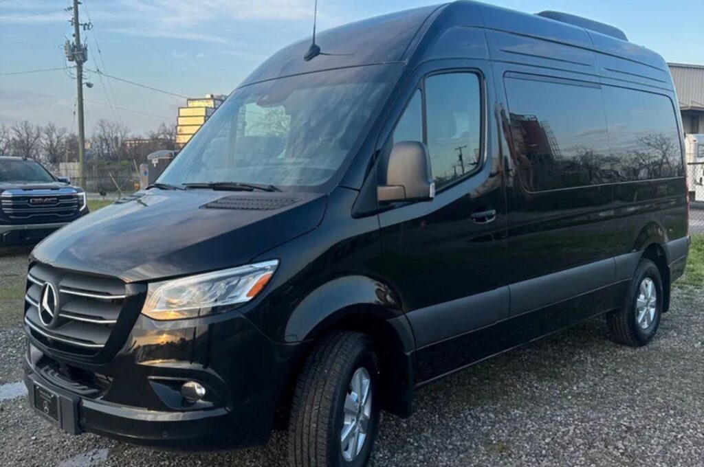 Black Mercedes-Benz Sprinter van parked outdoors.