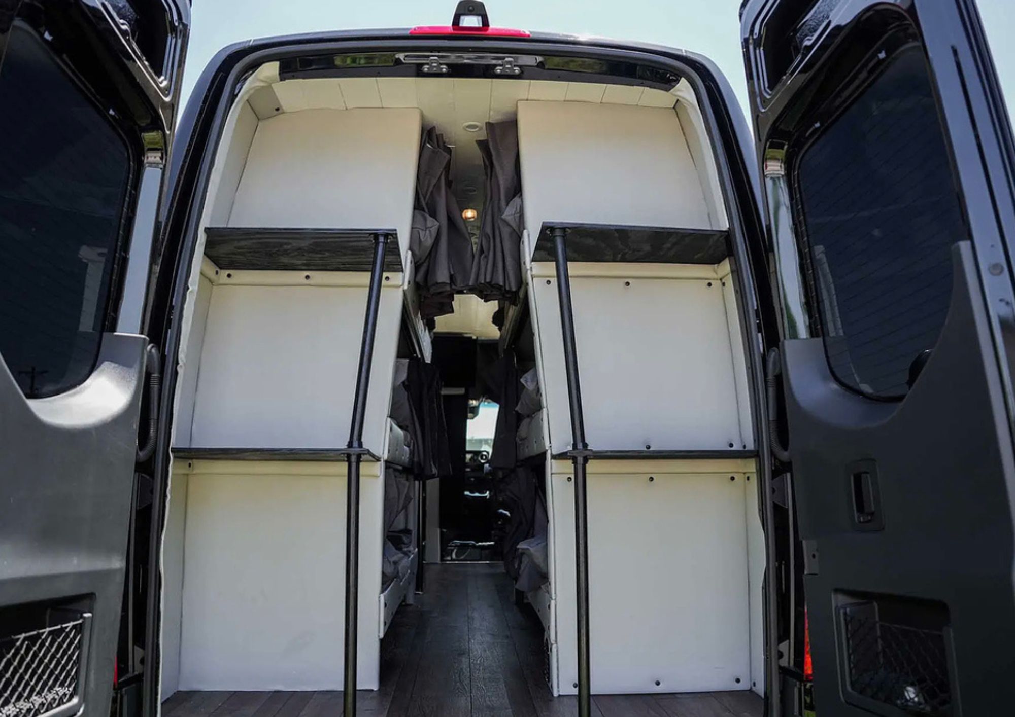 Rear view of custom camper van bunk beds.